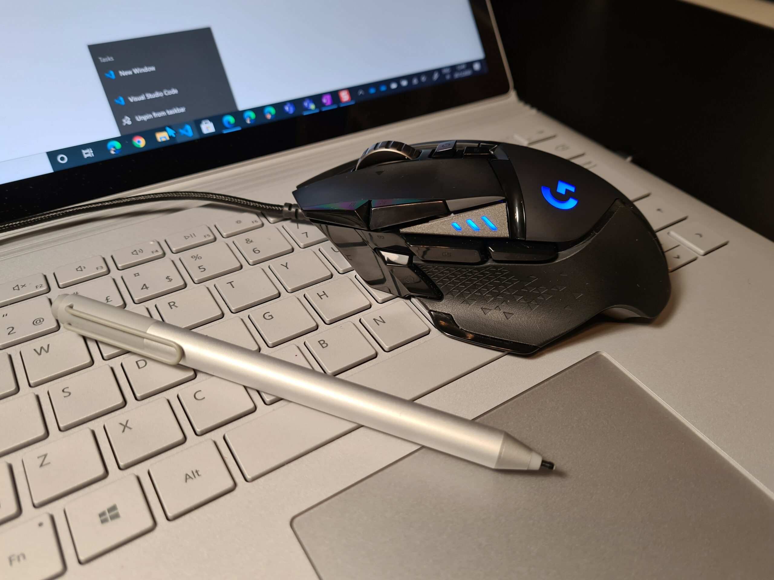 Laptop keyboard, Microsoft Surface Pen and Logitech mouse